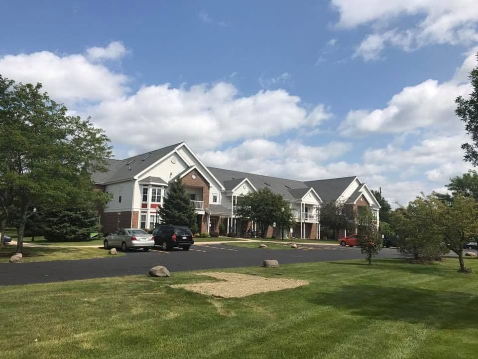 A commercial apartment building with new roofing.